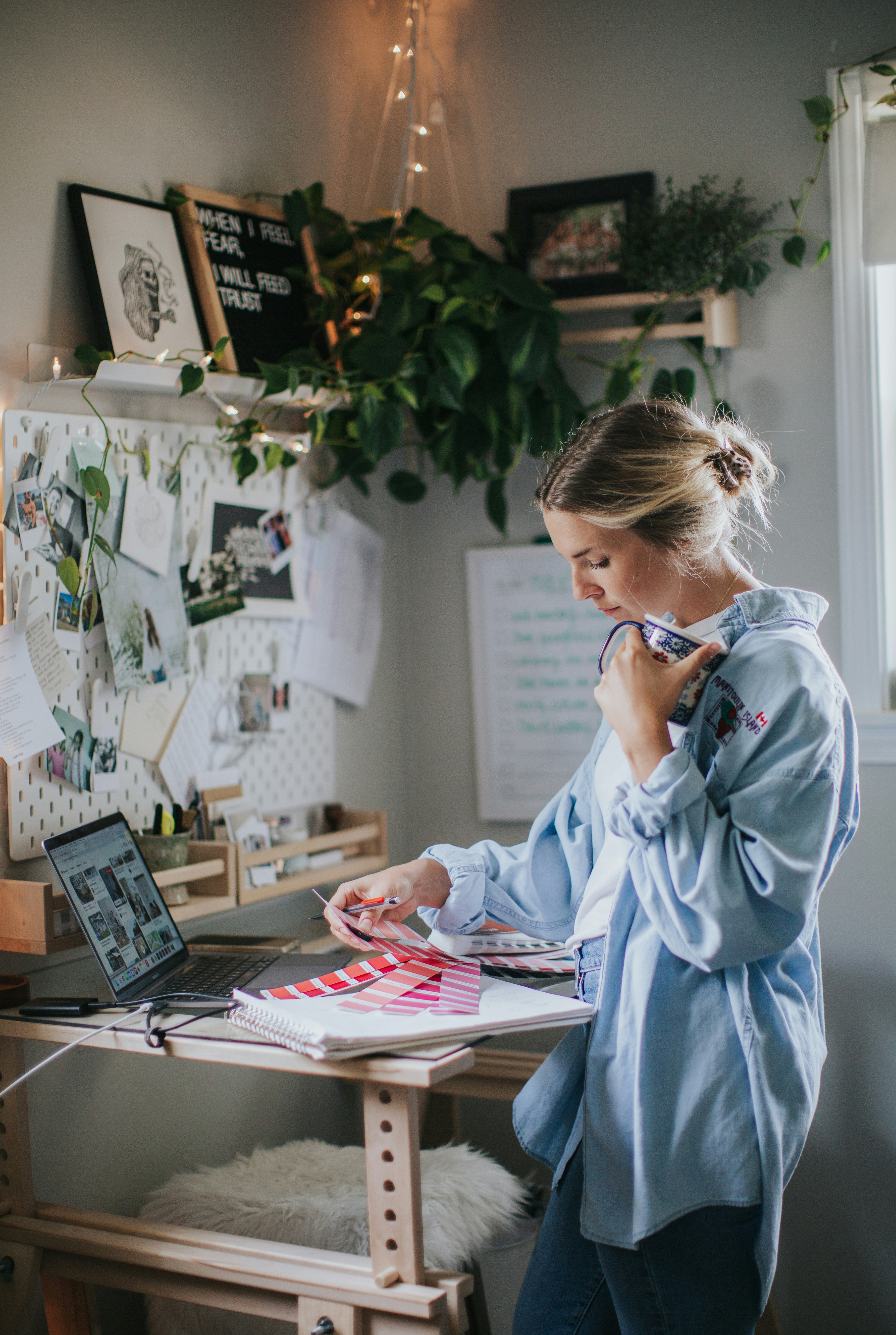 Independent professional working at a standing desk in a home office